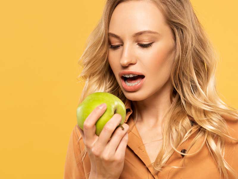 Girl is Eating An Apple