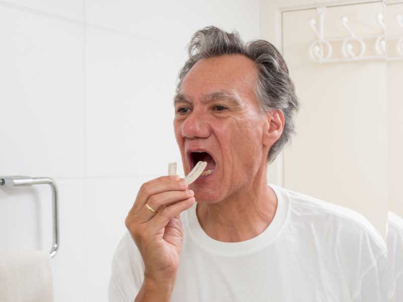 Old Man is Hanging a Mouth Guard